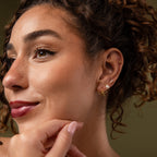 Model showcasing a styled look with our Tiny Bow Flatback Studs in Gold