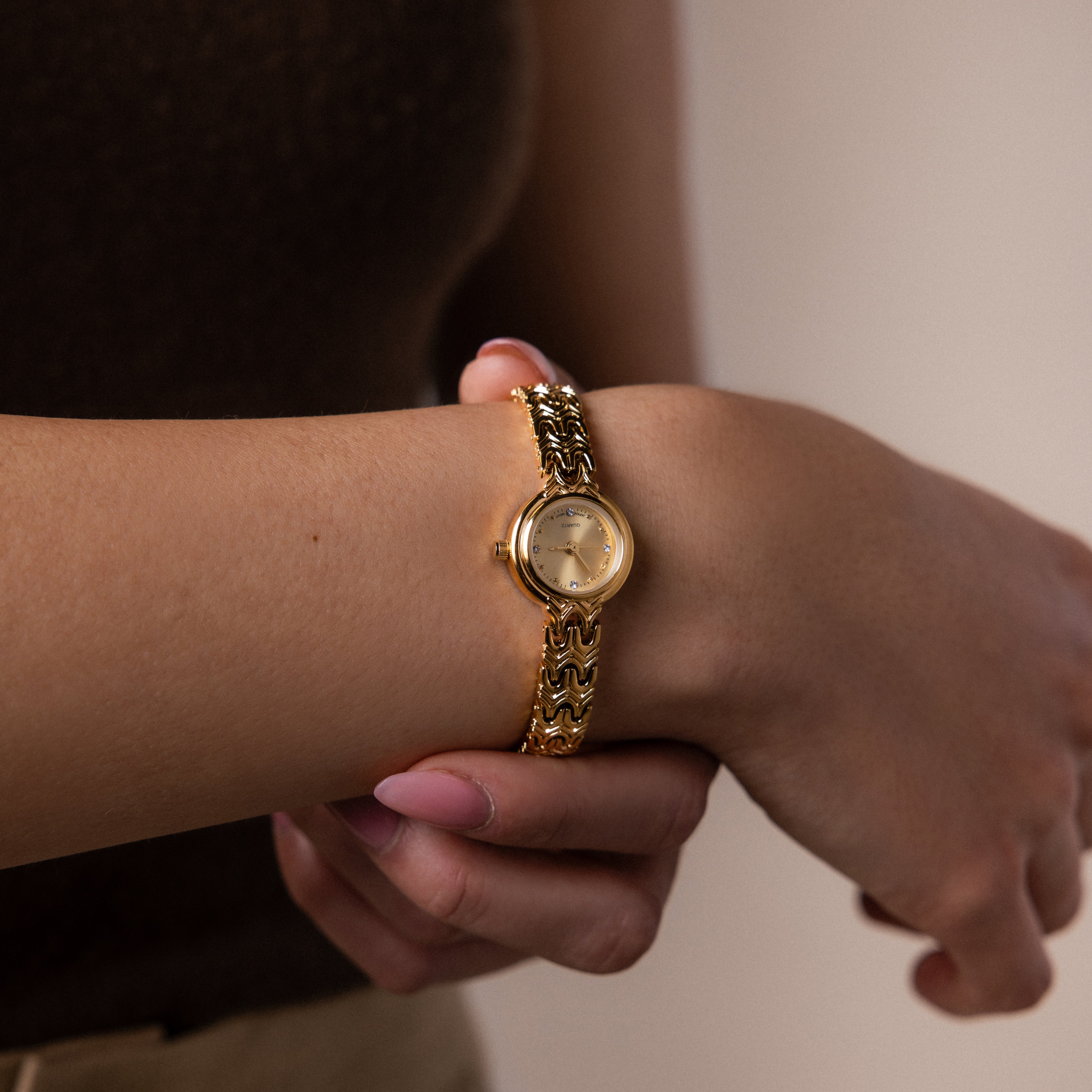 Close up of a model wearing our Wavy Link Timepiece watch