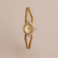 Our Duo Chain Diamond Timepiece on a beige background