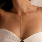 Model wearing a gold dainty Sparkling Diamond Lariat Necklace, which features a delicate mirror chain design with two CZ diamond stones.