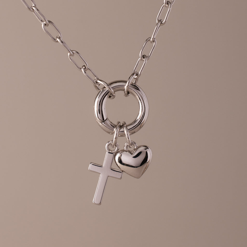Cross & Heart Charm Bracelet in Silver displayed on a neutral background.