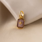 Up close of a light purple alexandrite north star charm with a pavé CZ diamond in the center.