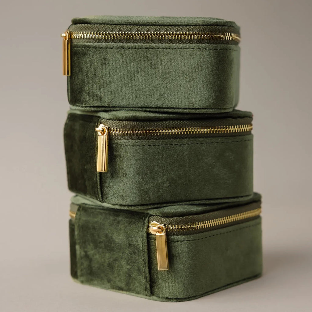 Three Green Velvet Jewelry Boxes, ideal for storing jewelry or using as compact travel cases, are stacked together against a neutral background.