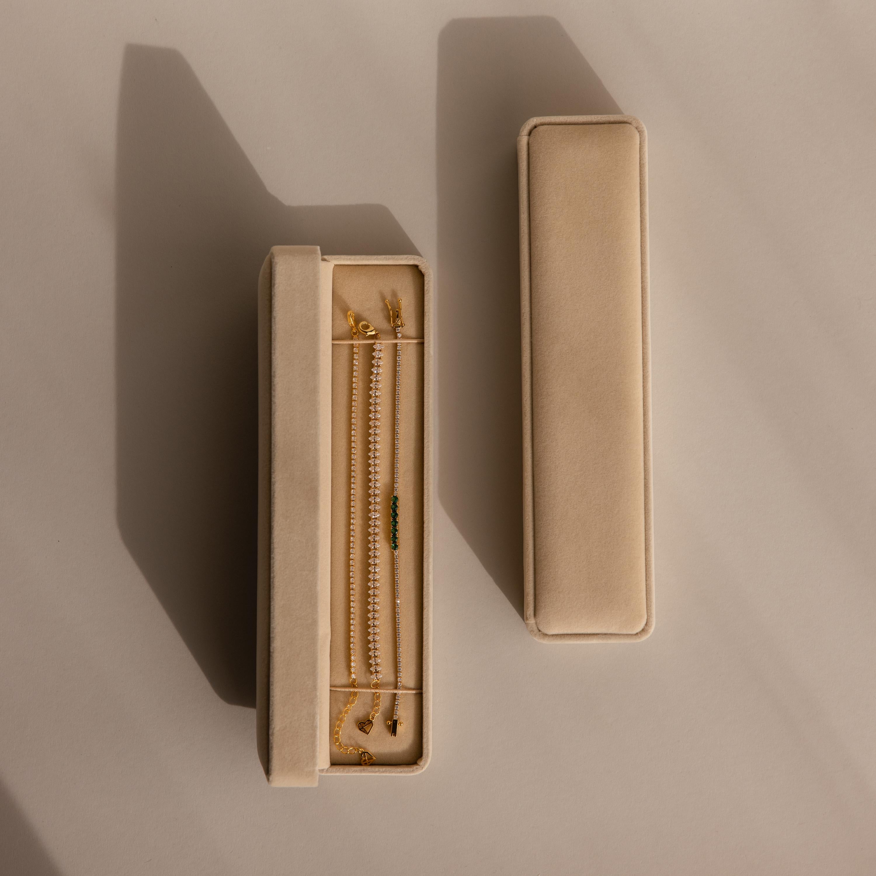 Two beige velvet Bracelet Travel Cases, one open with displayed gold jewelry, rest on a neutral background with soft shadows—perfect as a bracelet organizer or elegant travel case.