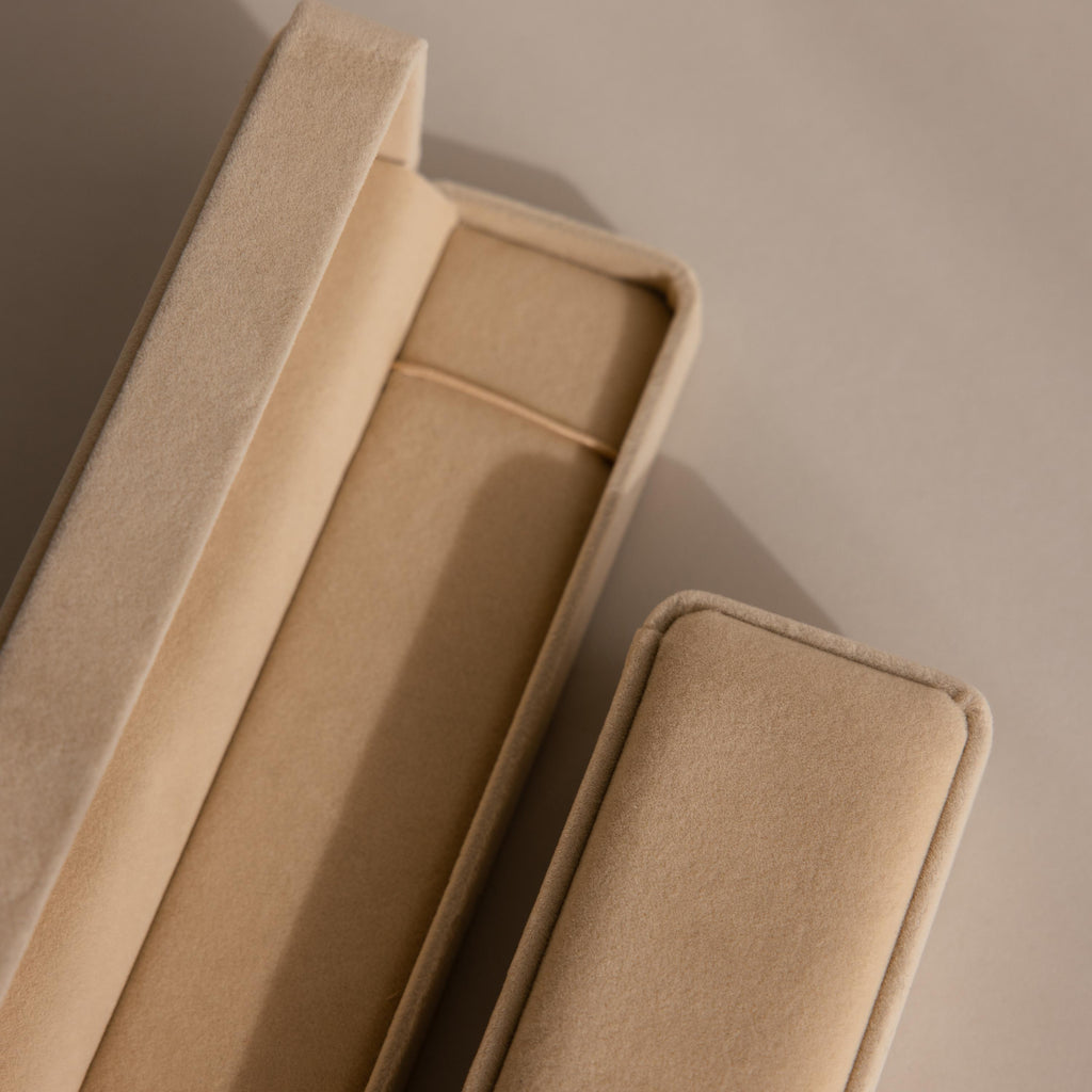 Beige Bracelet Travel Case on a matching beige background, viewed from above—evoking the soft elegance of a velvet jewelry case.