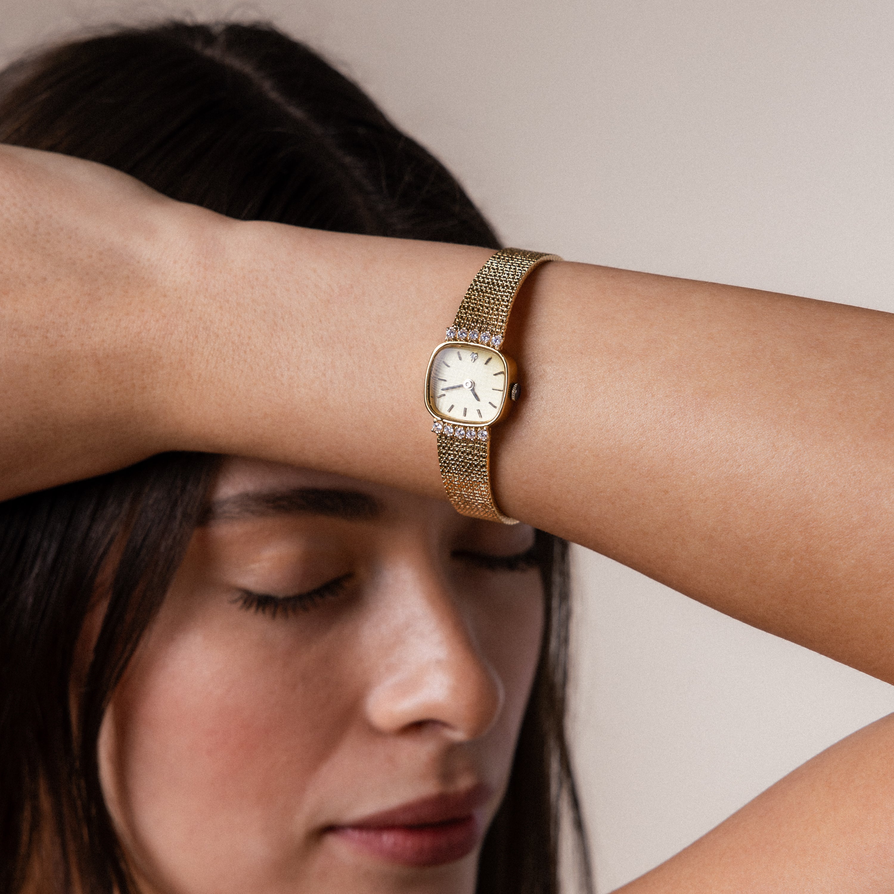 Model wearing our Luxe Square Timepiece watch in 18K Gold