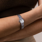 Close up of our Luxe Square Timepiece watch in Sterling Silver on a wrist
