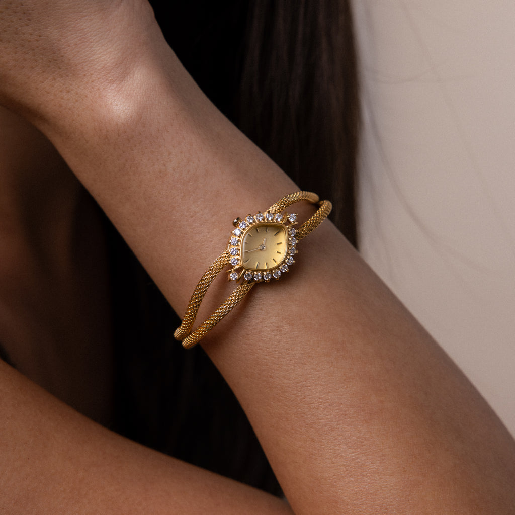 Our Duo Chain Diamond Timepiece on a wrist against a neutral background