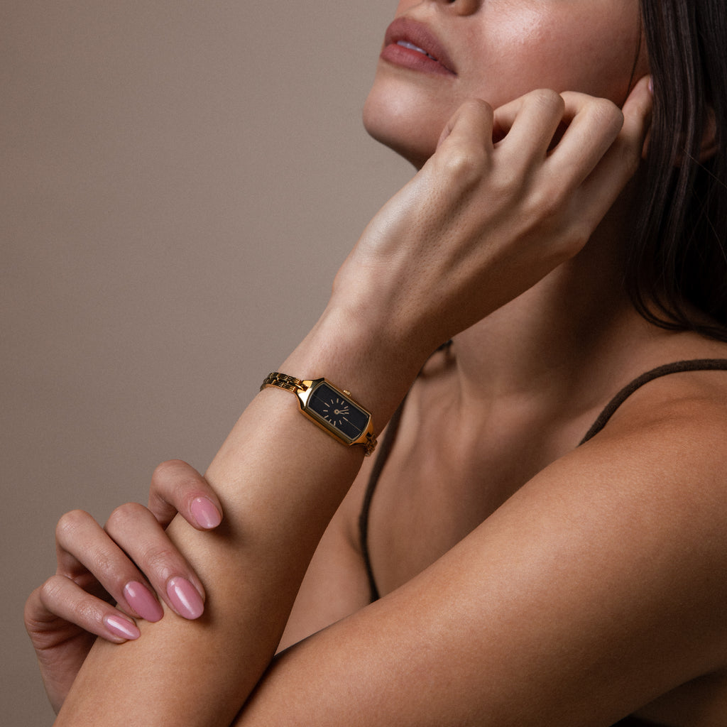 Model wearing our Midnight Link Timepiece watch with a neutral background