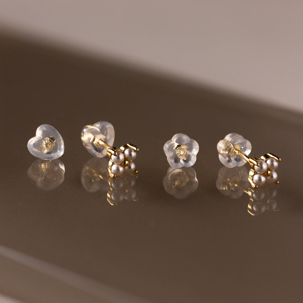 Heart & Flower Earring Backs—delicate gold and pearl accents add charm to your earring essentials, perfect for completing any look.