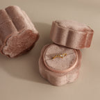 A Pink Flower Velvet Ring Box—one open with a gold gemstone ring inside, beside a matching closed box.