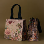 The Floral Gift Bag Add-On features two floral-patterned tote bags with dark handles on an olive-green background—an elegant and unique gift wrap to enhance any present.