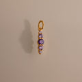 Ombre Lace Alexandrite Charm pendant featuring five small purple gemstones arranged vertically on a neutral background.