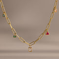 The Mixed Birthstone Charm Necklace features unique square and triangle charms with colorful gemstones, making it the perfect personalized jewelry piece for charm necklace lovers.