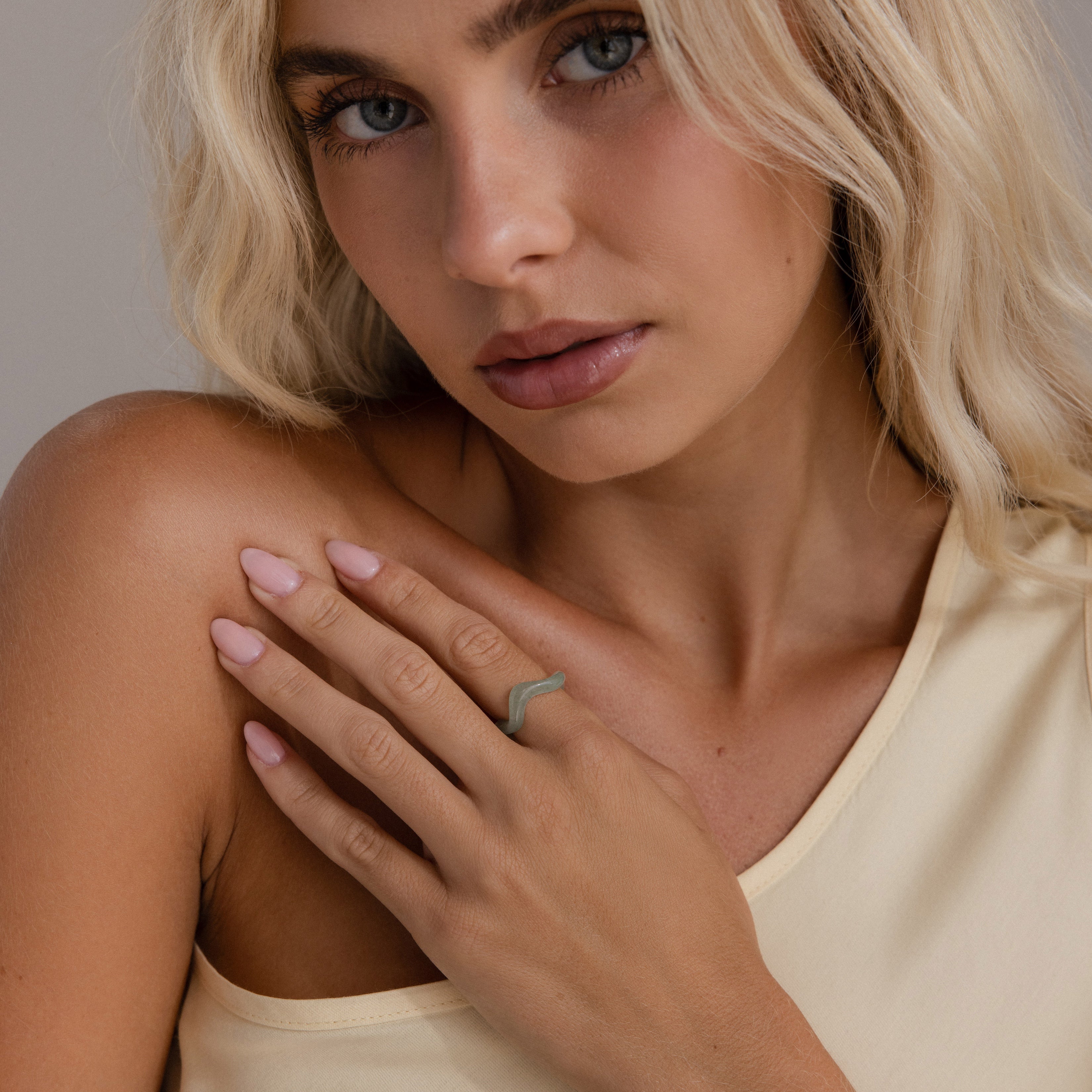Model wears Jade Wave Ring on index finger