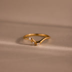 Gold curve marquise diamond ring with three sparkling marquise-cut diamonds in a chevron setting.