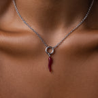 The Chili Pepper Charm in Sterling Silver necklace adds a vibrant, playful accent to the neck and collarbone, enhancing any jewelry collection with its unique design.