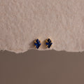 A pair of Rhombus Sapphire Flatback Studs, ideal for adding understated charm and modern glamour to any look.