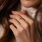 A woman's hand near her face displays the Toi et Moi Wrap Ring in Silver—a romantic, delicate jewelry piece.