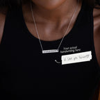 A woman wears a Handwriting Bar Necklace in Sterling Silver, engraved with "I love you forever" in handwritten script—a memorable personalized jewelry gift.