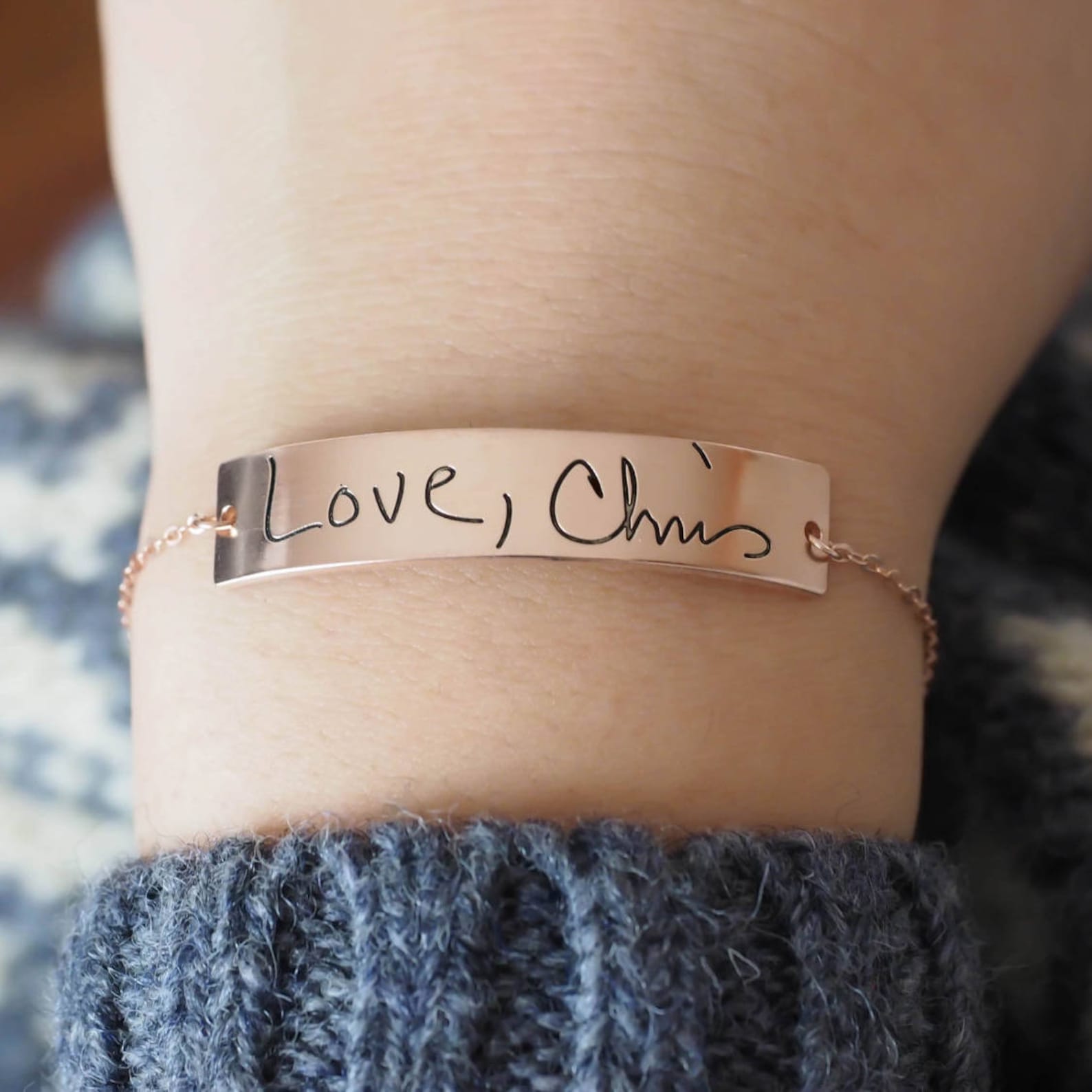 The Handwriting Bar Bracelet in rose gold features custom engraving—like “Love, Chris”—making it the perfect personalized jewelry piece for your wrist.