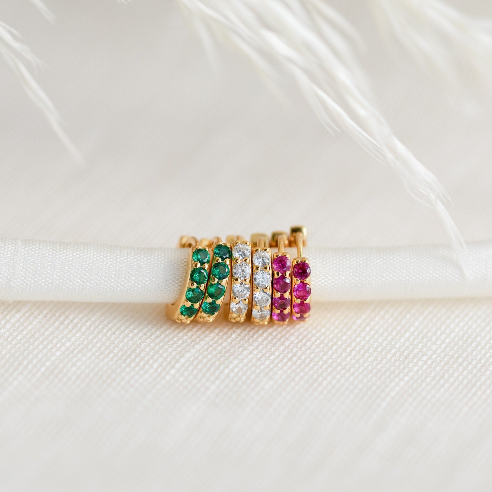 A close-up of the Elise Gemstone Huggies Set, showcasing exquisite details and the elegance reminiscent of artisan-crafted earrings.