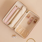 Open Rectangle Velvet Jewelry Case with compartments, shown beside pearl heart earrings and a gold necklace on a beige background.
