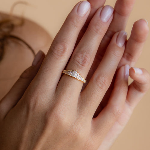 A hand with manicured nails wears the Art Deco Diamond Ring in Sterling Silver on the ring finger—a true statement piece.