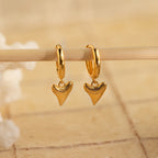 Shark Tooth Huggies feature small, textured shark tooth-shaped pendants—unique Shark Tooth Earrings and a stylish addition to your beach jewelry collection.