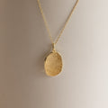Custom Fingerprint Necklace in Rose Gold featuring an oval pendant engraved with a unique fingerprint, shown on a neutral background—an ideal sentimental gift.