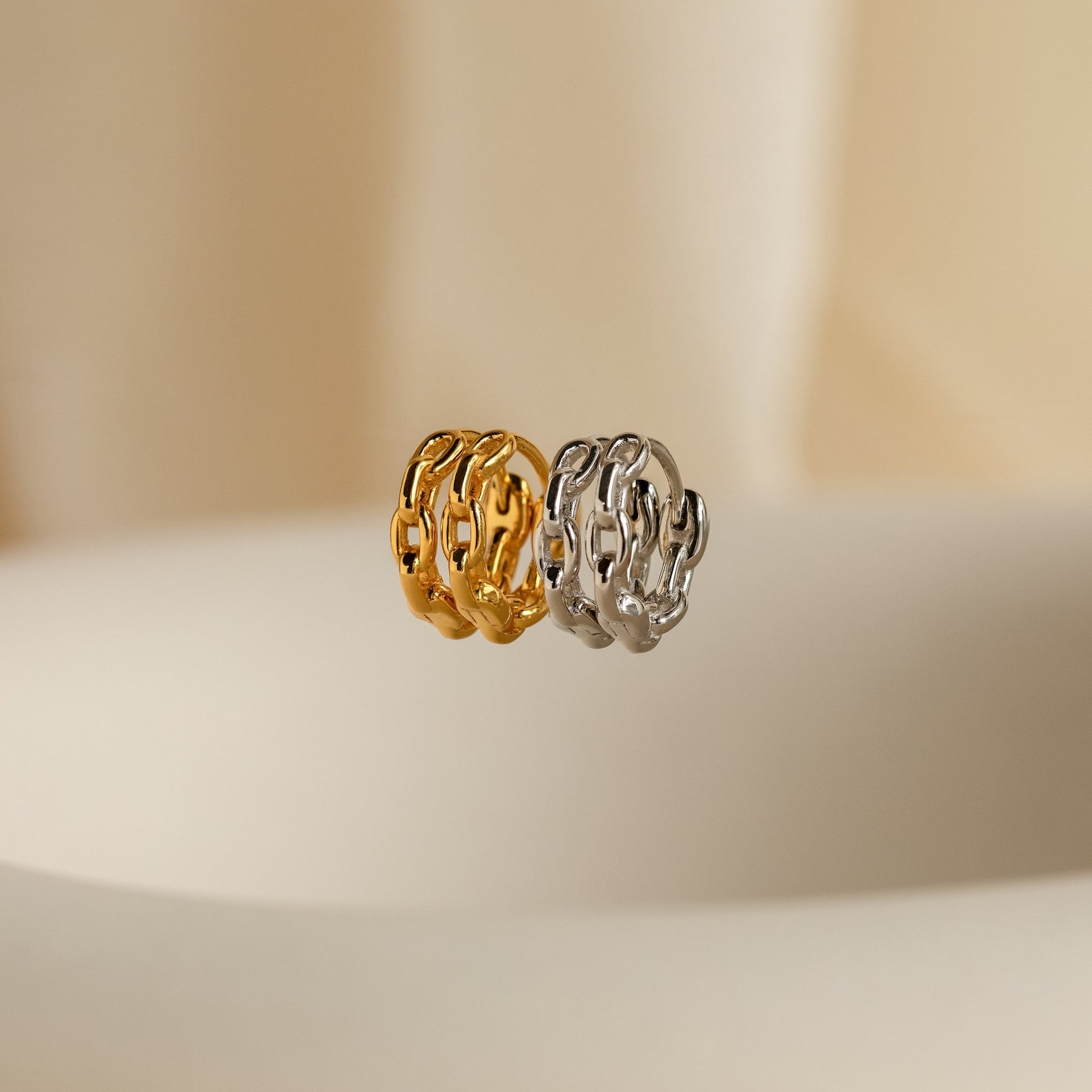 Link Huggies are versatile gold and silver earrings, perfect for a chic earring stack or elevating your style with dainty chain details.