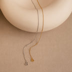 The Micro Rolo Chain Anklet features a delicate design in silver or gold with a tiny heart charm—ideal for fans of minimalistic jewelry.