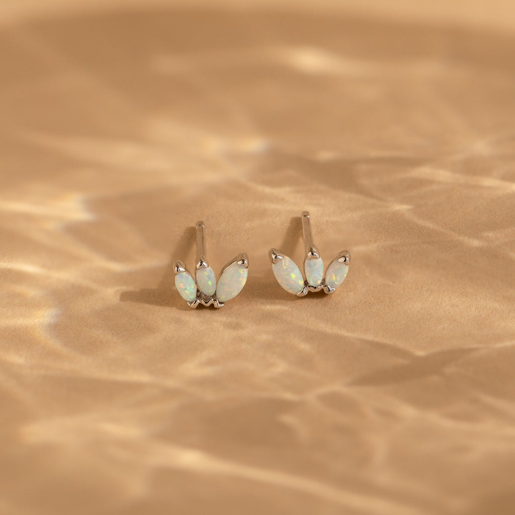 Add a playful touch to your style with the Opal Marquise Studs—elegant earrings featuring sparkling white opal stones in a chic design.
