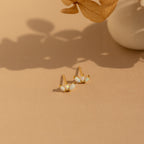 Opal Marquise Studs with shimmering white stones, perfect for adding a playful floral touch to your jewelry collection.