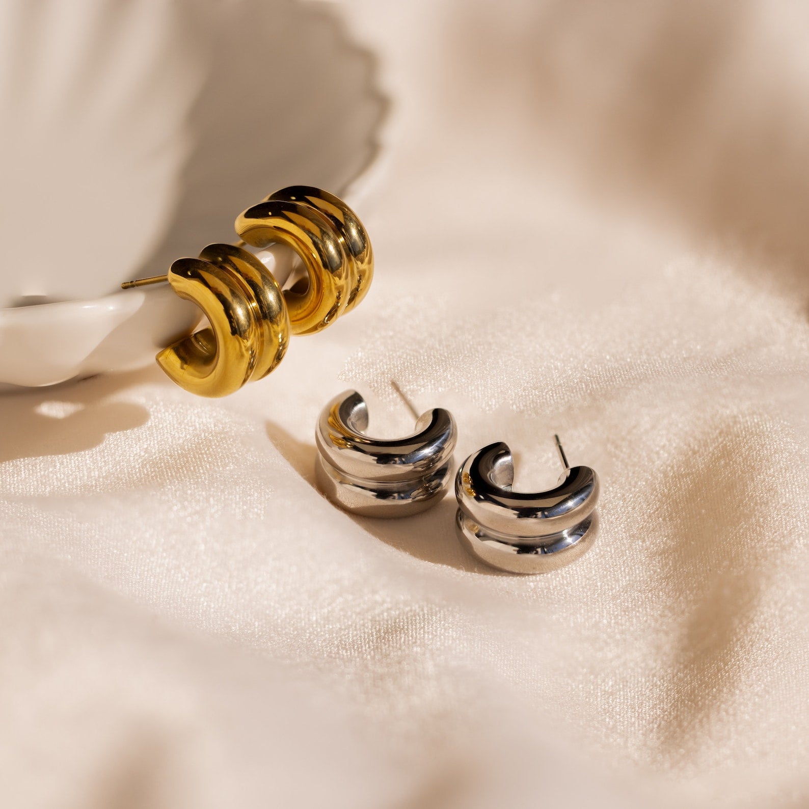 Chunky Double Hoops displayed on a white surface—ideal as a statement accessory for minimalist jewelry lovers.