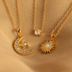 The Opal Moon & Star Necklace shines beautifully on soft beige fabric, highlighting its gold finish and celestial charms.