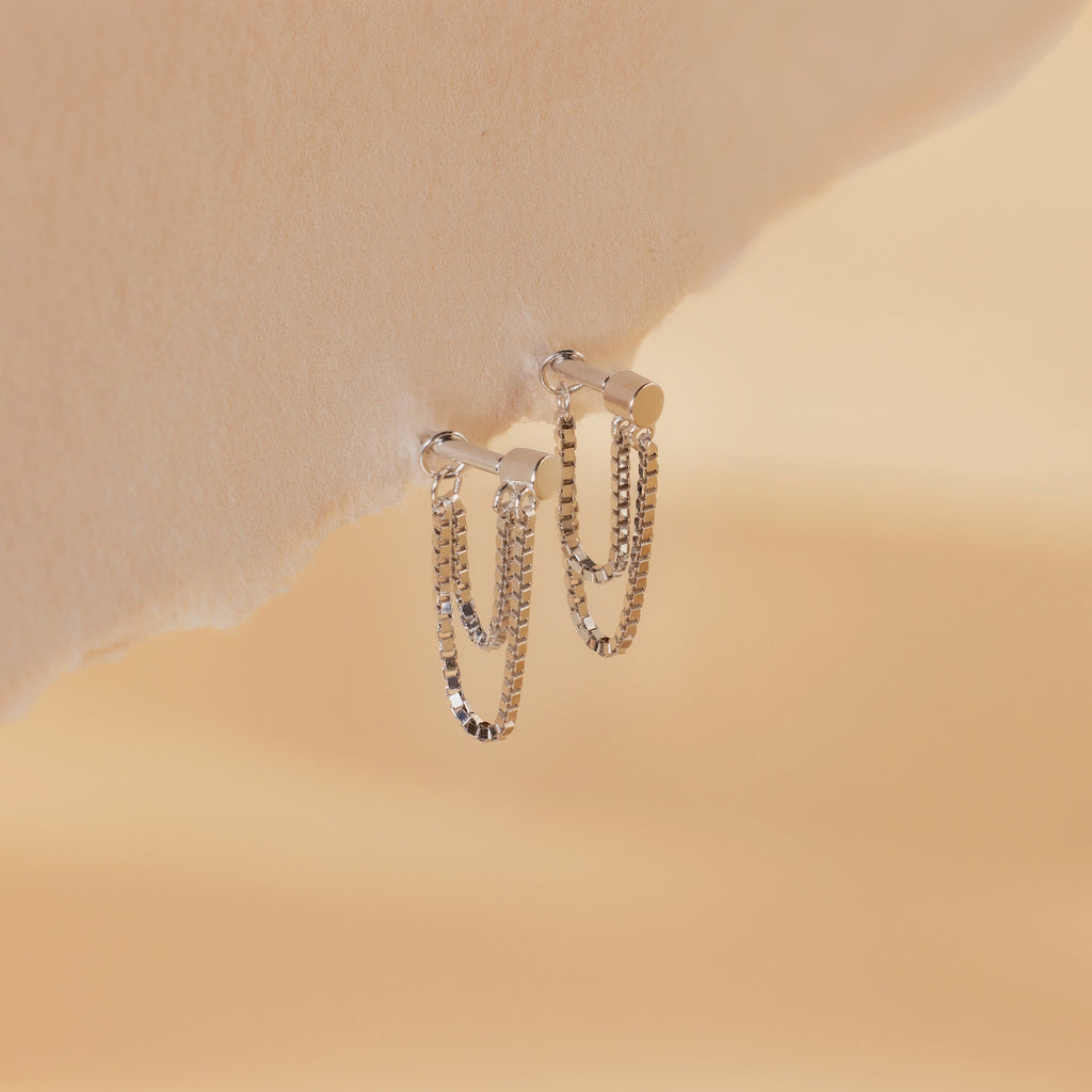 Flatback Chain Earrings shown on a soft beige textured background—ideal minimalist earrings to elevate your next earring stack.