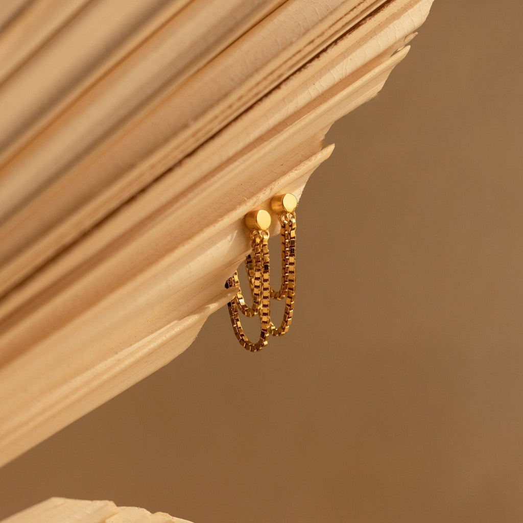 Flatback Chain Earrings draped over angled, light-colored wooden slats with a soft brown background—perfect for creating an elegant, minimalist earring stack.