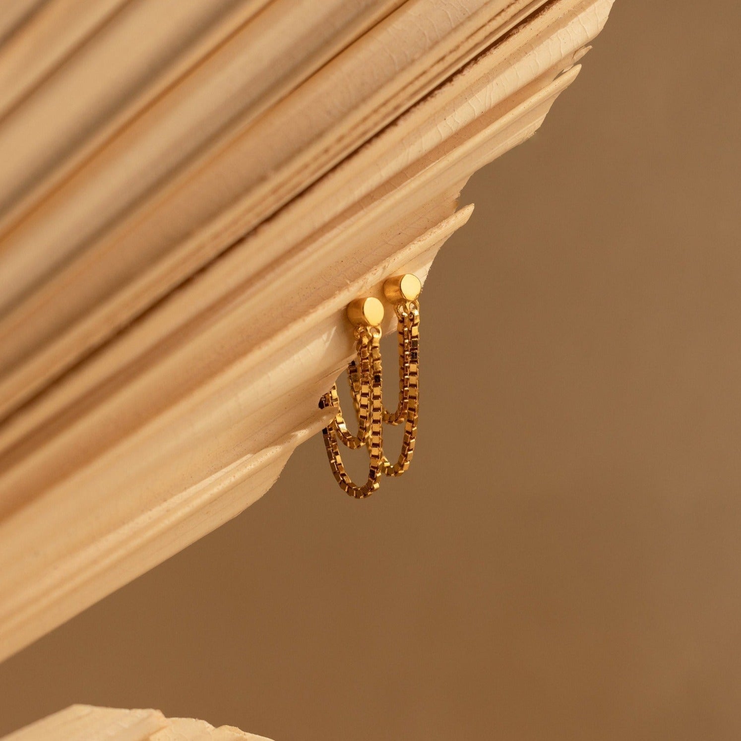 Flatback Chain Earrings draped over angled, light-colored wooden slats with a soft brown background—perfect for creating an elegant, minimalist earring stack.
