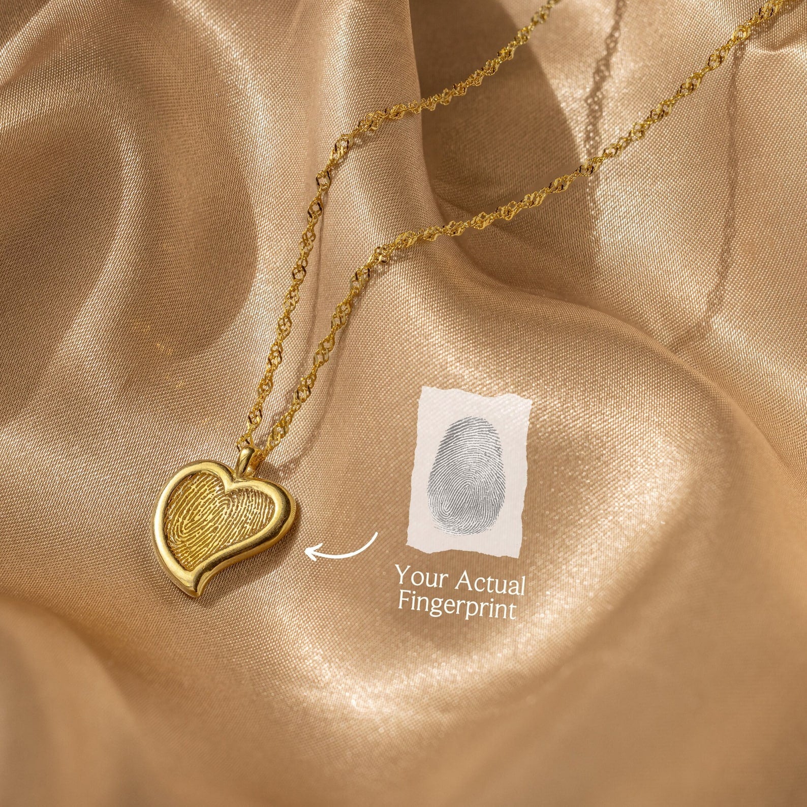 Fingerprint Heart Necklace shown on satin, labeled "Your Actual Fingerprint" with an arrow—makes a meaningful Mother's Day or memorial gift.