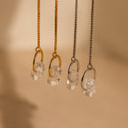 Two pairs of necklaces with clear crystal pendants—one on gold, one on silver chains—look stunning when paired with Herkimer Diamond Threader Earrings for a coordinated, elegant look.