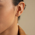 Close-up of a person wearing Herkimer Diamond Threader Earrings, featuring delicate chain threads with a clear Herkimer diamond pendant—perfect for those who love dainty, dangling charm earrings.