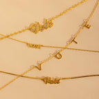 Essential Vote Necklaces: Four gold necklaces on a beige background, each with a unique “Vote” pendant—an ideal statement piece and thoughtful gift for voters.