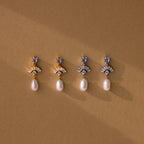 Four pairs of Aquamarine Pearl Drop Earrings—two gold, two silver—evoke vintage glamour, making perfect wedding jewelry and displayed elegantly on a brown background.
