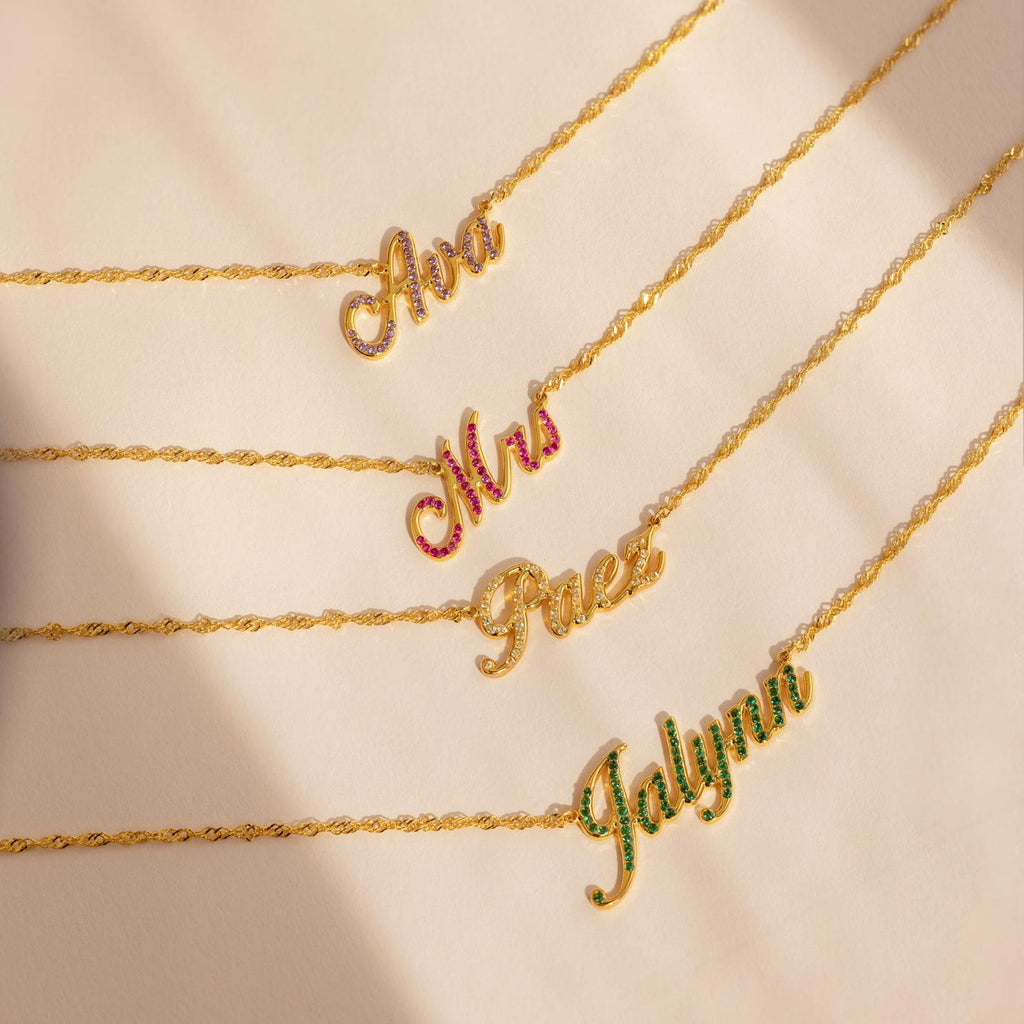 Five Elegant Birthstone Name Necklaces spell Ana, Mrs, Faez, and Jalynn—each accented with a unique gem. This stunning collection is perfect for custom jewelry lovers seeking personalized style.