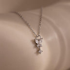 Close-up of the Diamond Butterfly Drop Jewelry Set in Sterling Silver, featuring a delicate diamond butterfly pendant resting gracefully on smooth, light-colored skin.