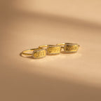 The Custom Pave Hexagon Ring rests on a beige surface—a perfect personalized minimalist ring with a modern geometric design.