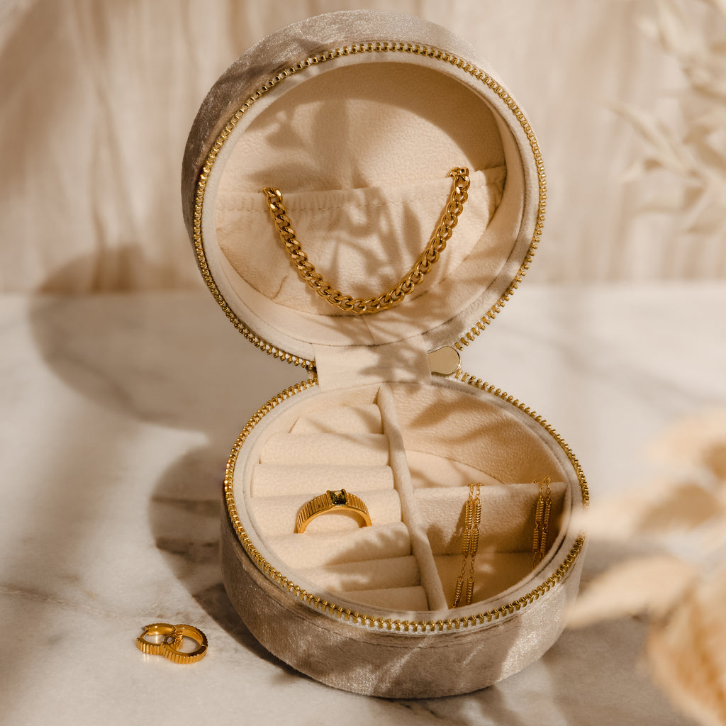 The Mystery Jewelry Box contains handpicked gold rings and a delicate gold chain.