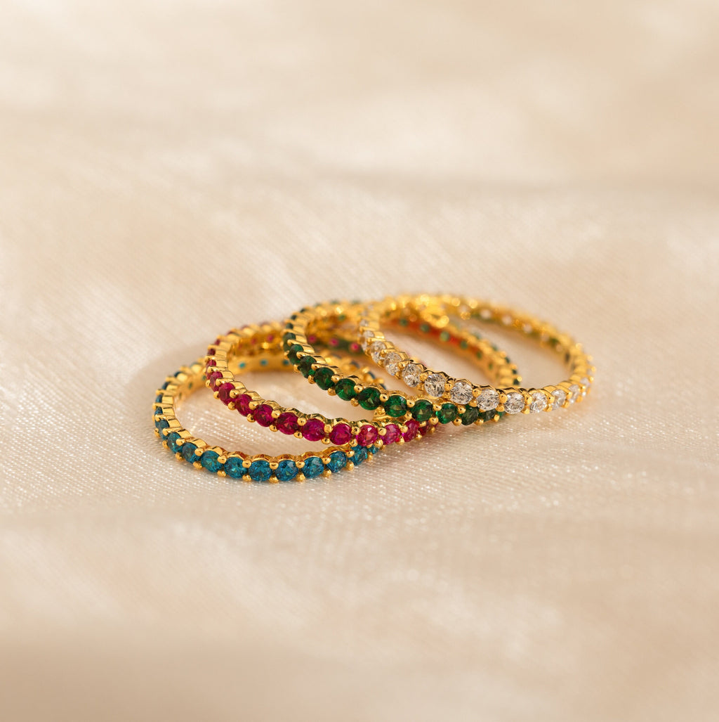 The Eternity Tennis Birthstone Ring, available in vibrant colors, is a customizable piece that makes a thoughtful Christmas gift for someone special.