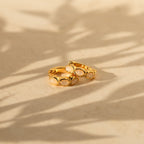 The Moonstone Huggies are gold dainty earrings perfect for everyday wear.